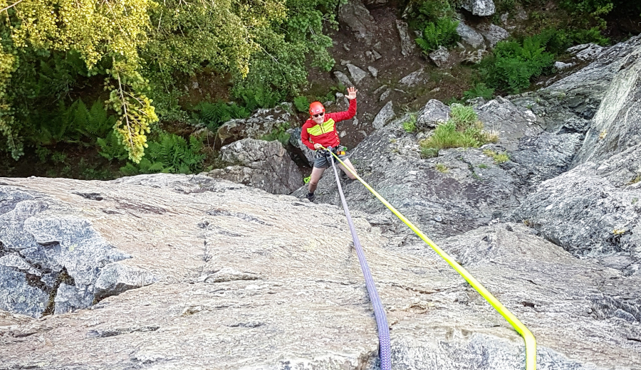 A stag doing big abseil in Snowdonia North Wales